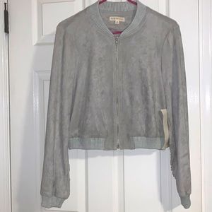 Grey faux suede Hot & delicious zip up jacket. Frayed cuts down back of jacket.
